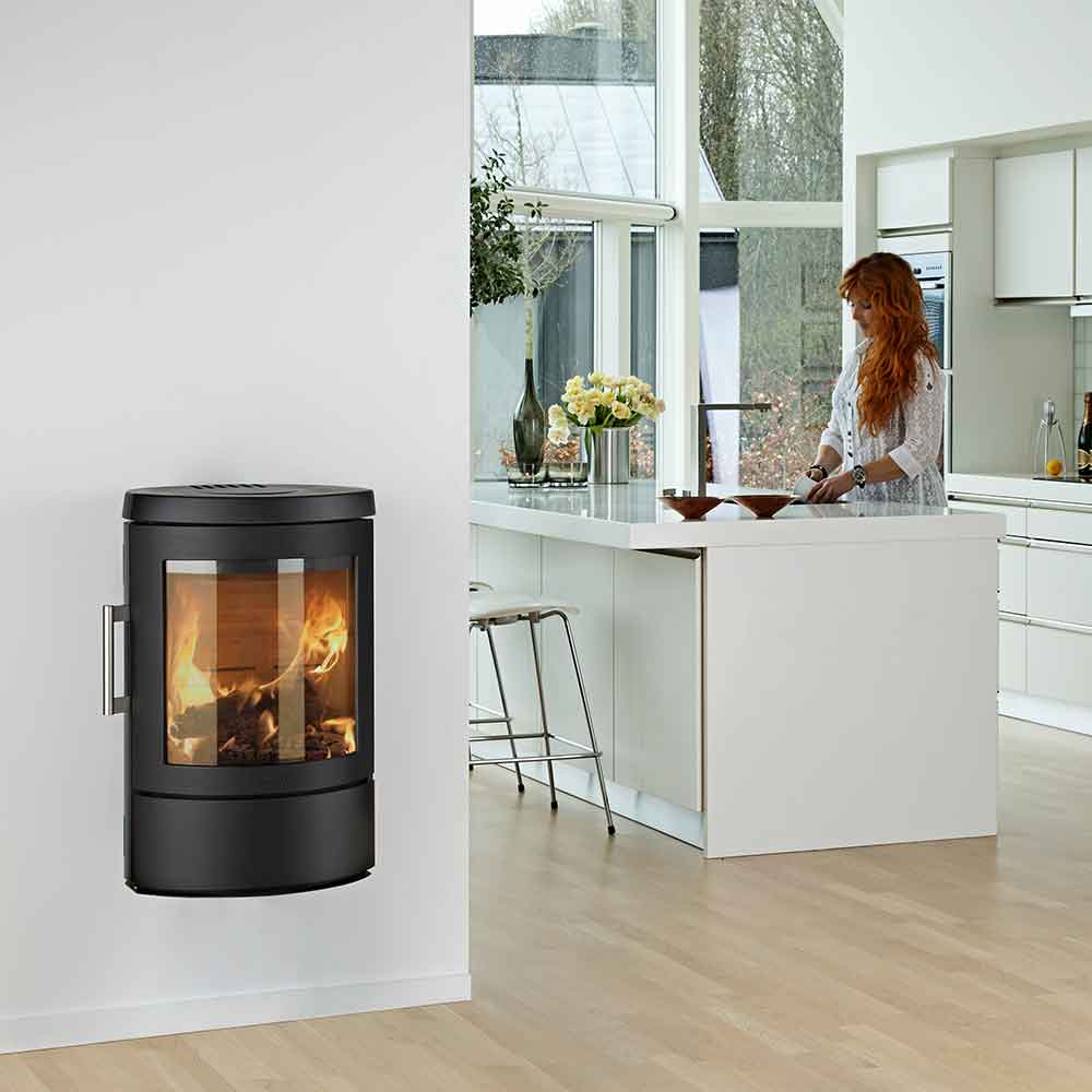 HWAM 3110c wood-burning stove in a room setting