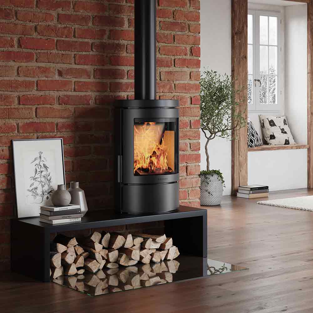 HWAM 3110c wood-burning stove in a room setting