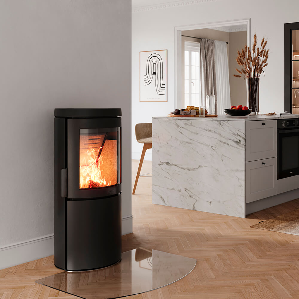HWAM 3120c wood-burning stove with Classic door in a room setting