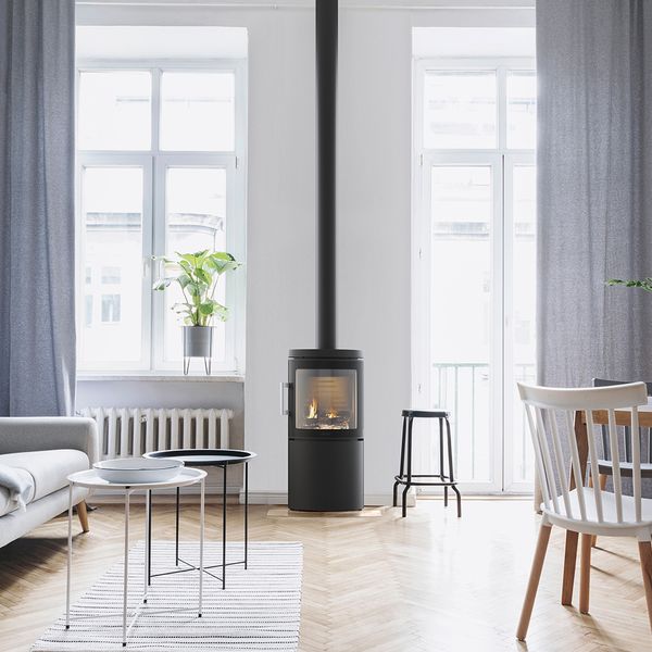 HWAM 3120m wood-burning stove in a room setting