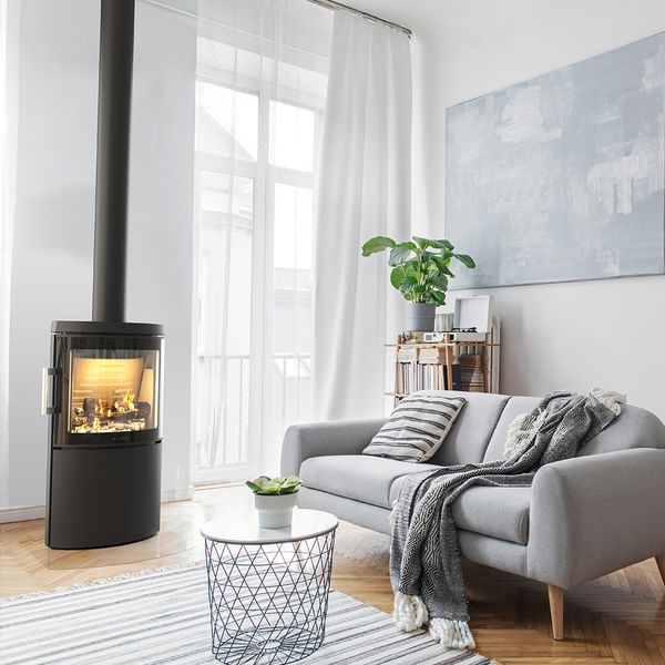 HWAM 3120m wood-burning stove in a room setting