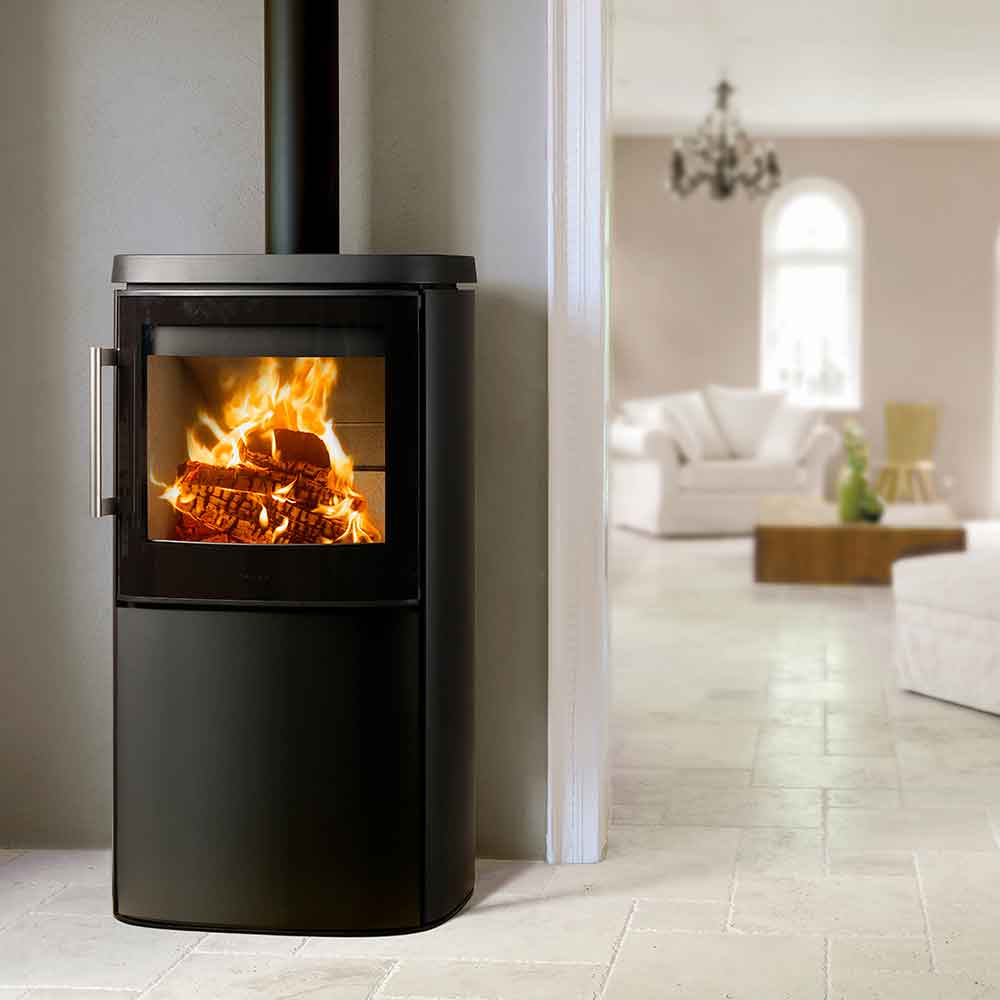 HWAM 4640m wood-burning stove in a room setting