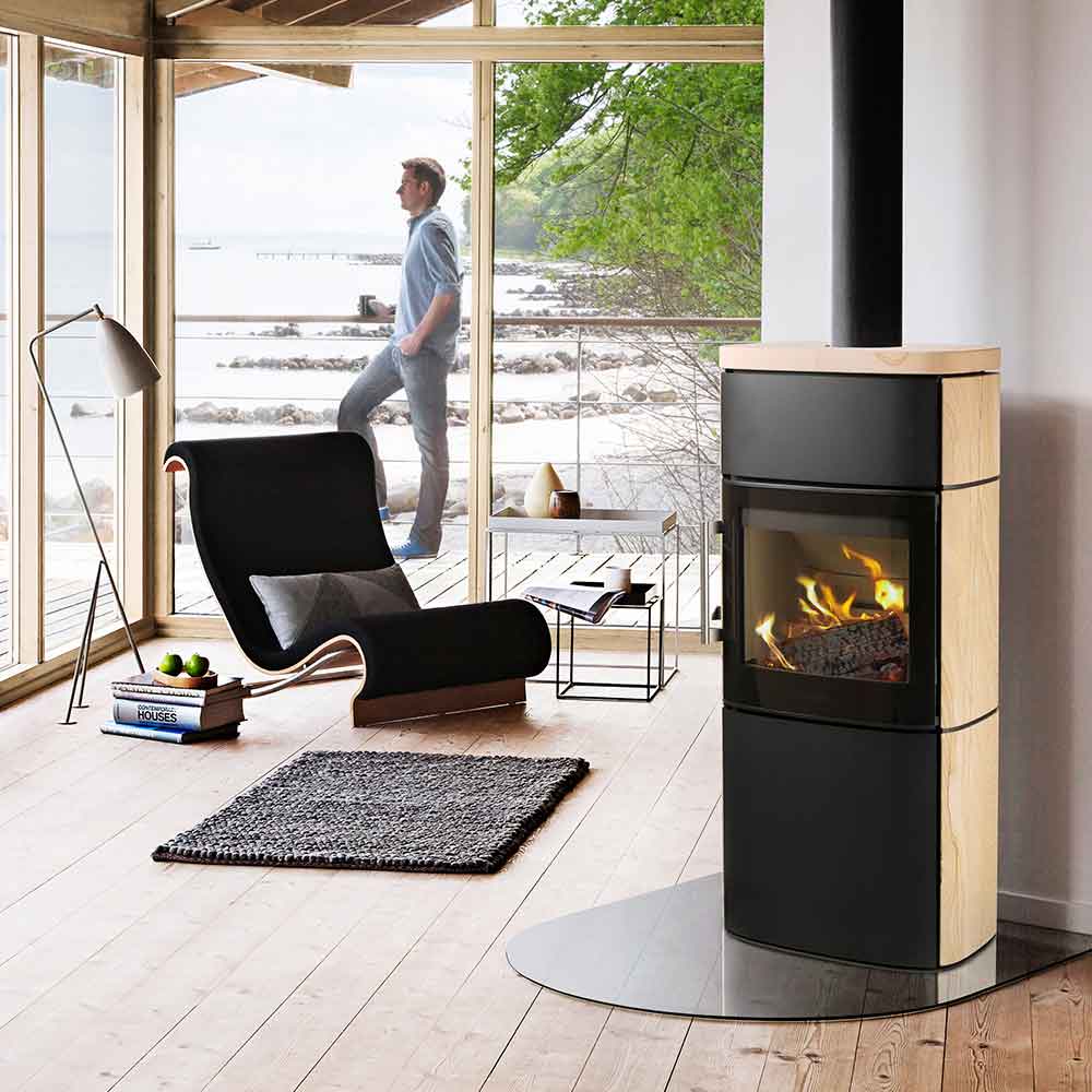HWAM 4660m wood-burning stove in a room setting