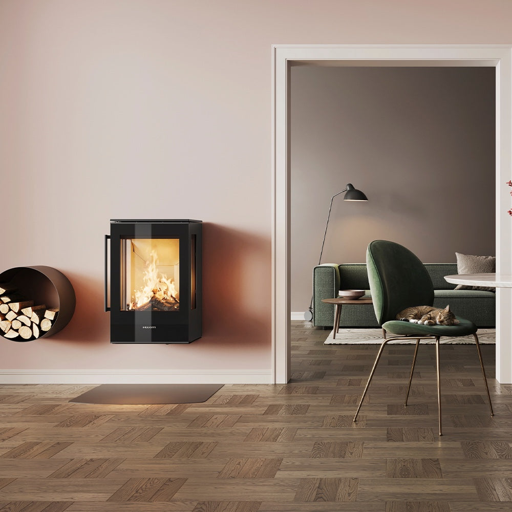 HWAM 5210m wood-burning stove in a room setting