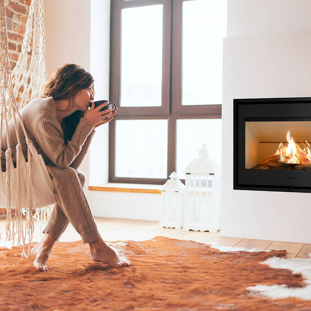 HWAM I 40/55c wood-burning stove in a room setting