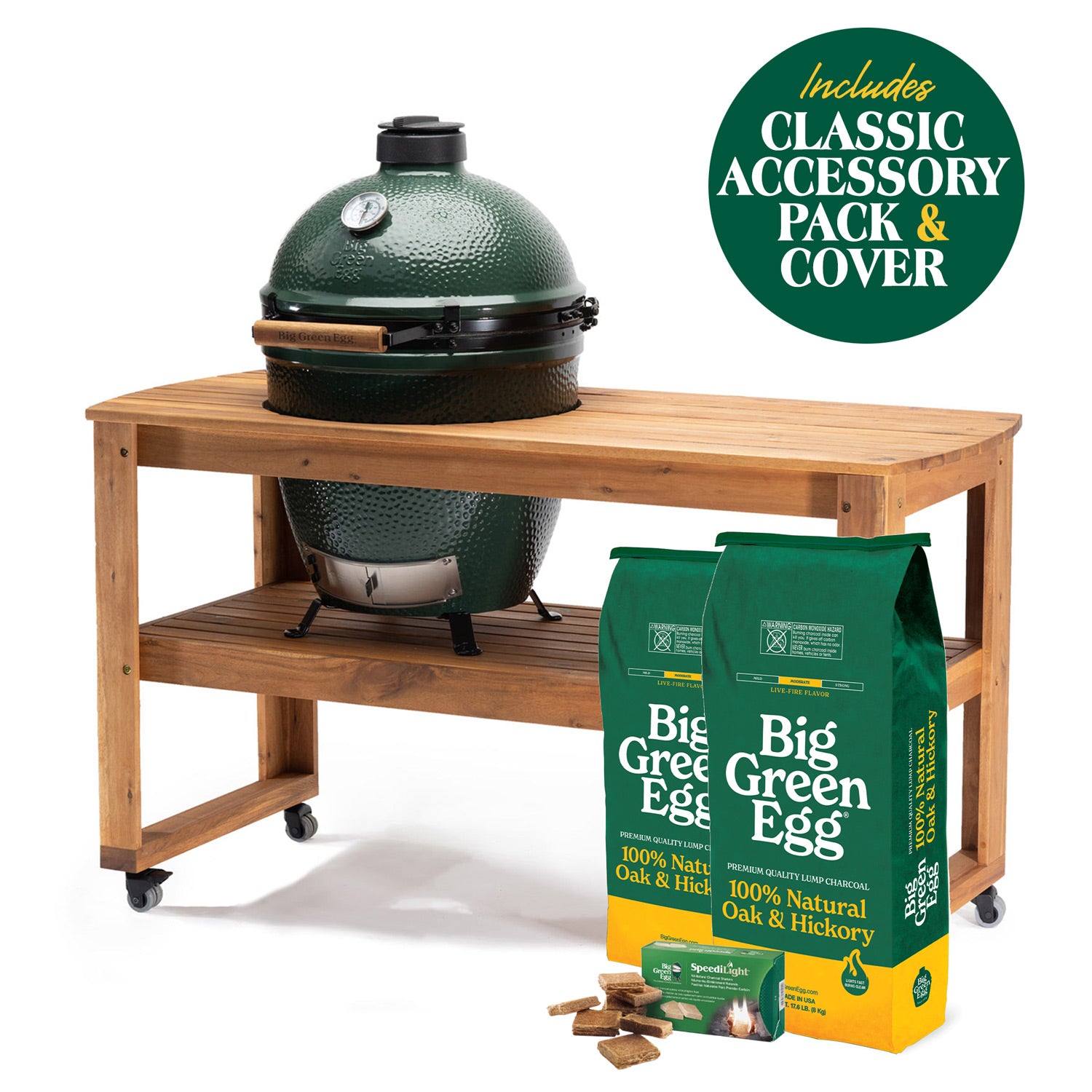 Large Big Green Egg in a wooden table, with charcoal, firestarters and a Classic accessory-pack badge
