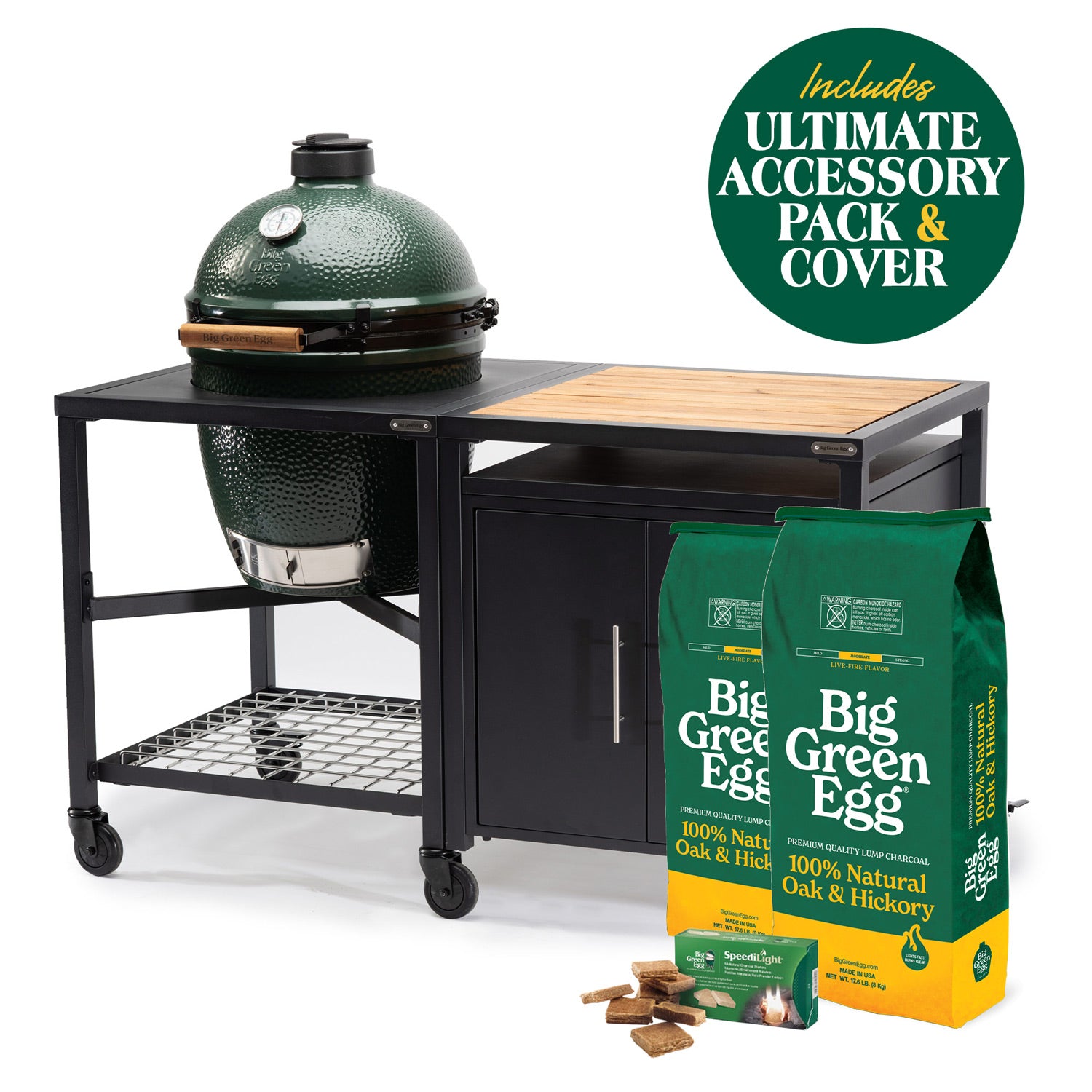 Large Big Green Egg in a modular nest beside a cabinet, with charcoal, firestarters and an Ultimate accessory-pack badge