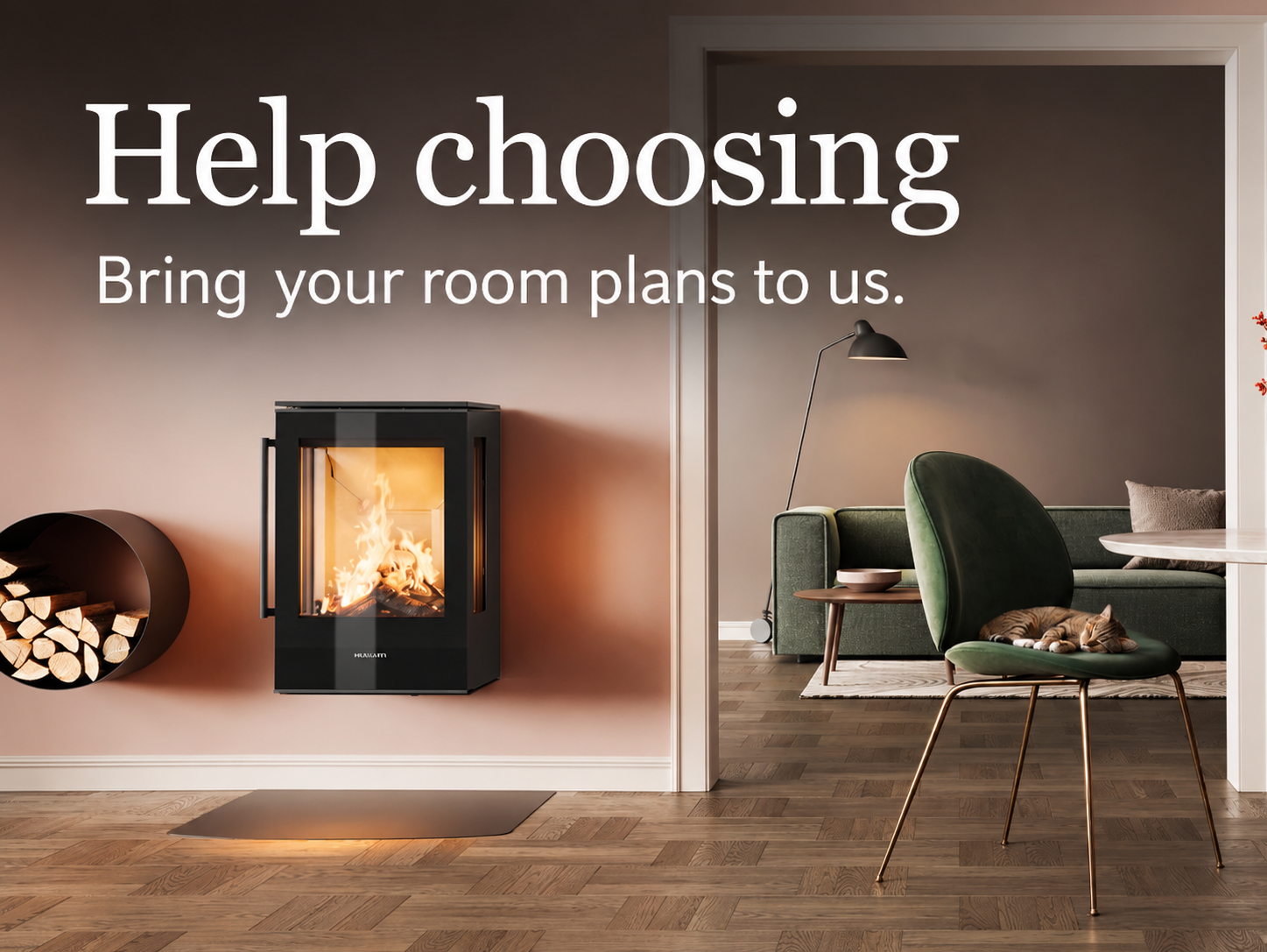 Help choosing. Bring your room plans to us. HWAM wall-mounted stove in a warm pink room beside a green chair