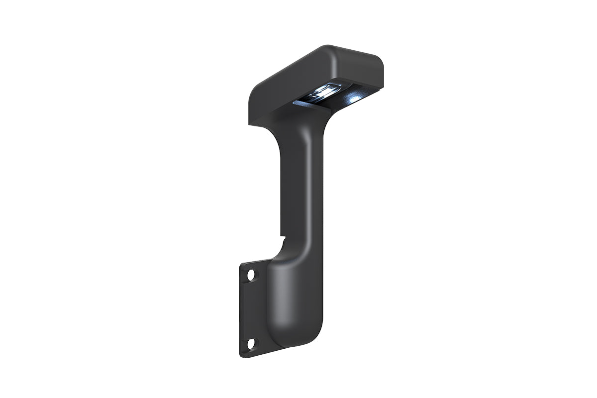 Traeger Pellet Sensor viewed at an angle, showing its illuminated underside and mounting holes