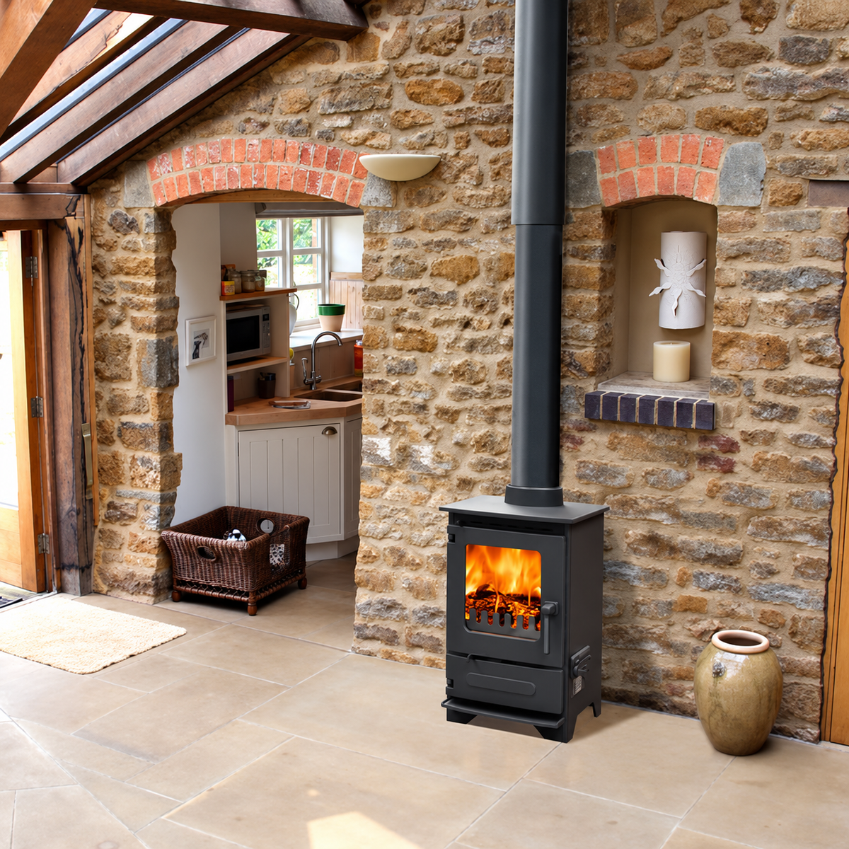 Dunsley Highlander 3 Enviroburn SG with a black handle burning logs beside a stone wall