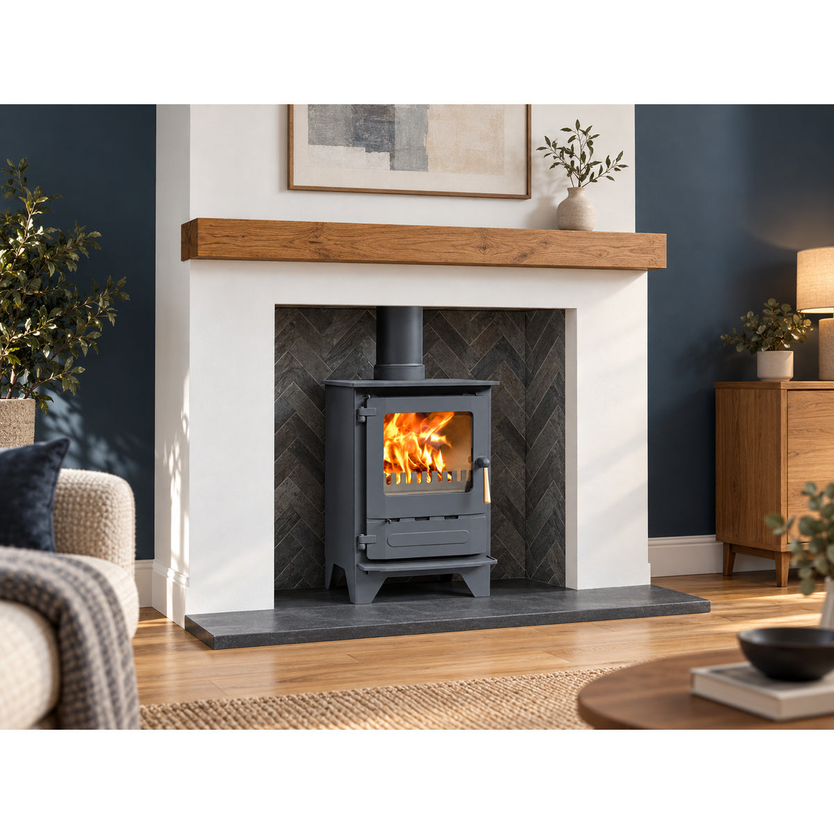 Dunsley Highlander 5 Enviroburn SG with high legs and a wood handle in an illustrative blue room with a slate hearth and herringbone chamber
