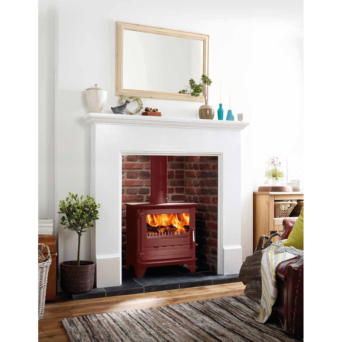 Dunsley Highlander 8 Enviroburn SG in optional Mojave Red burning logs in a white fireplace