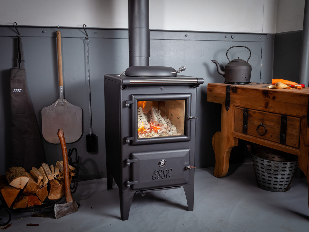 ESSE Bakeheart wood-fired cook stove installed in a furnished room