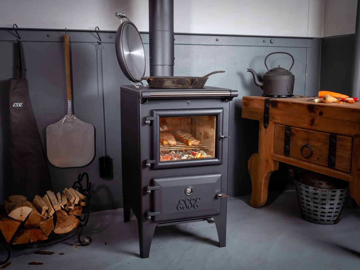 ESSE Bakeheart wood-fired cook stove installed in a furnished room