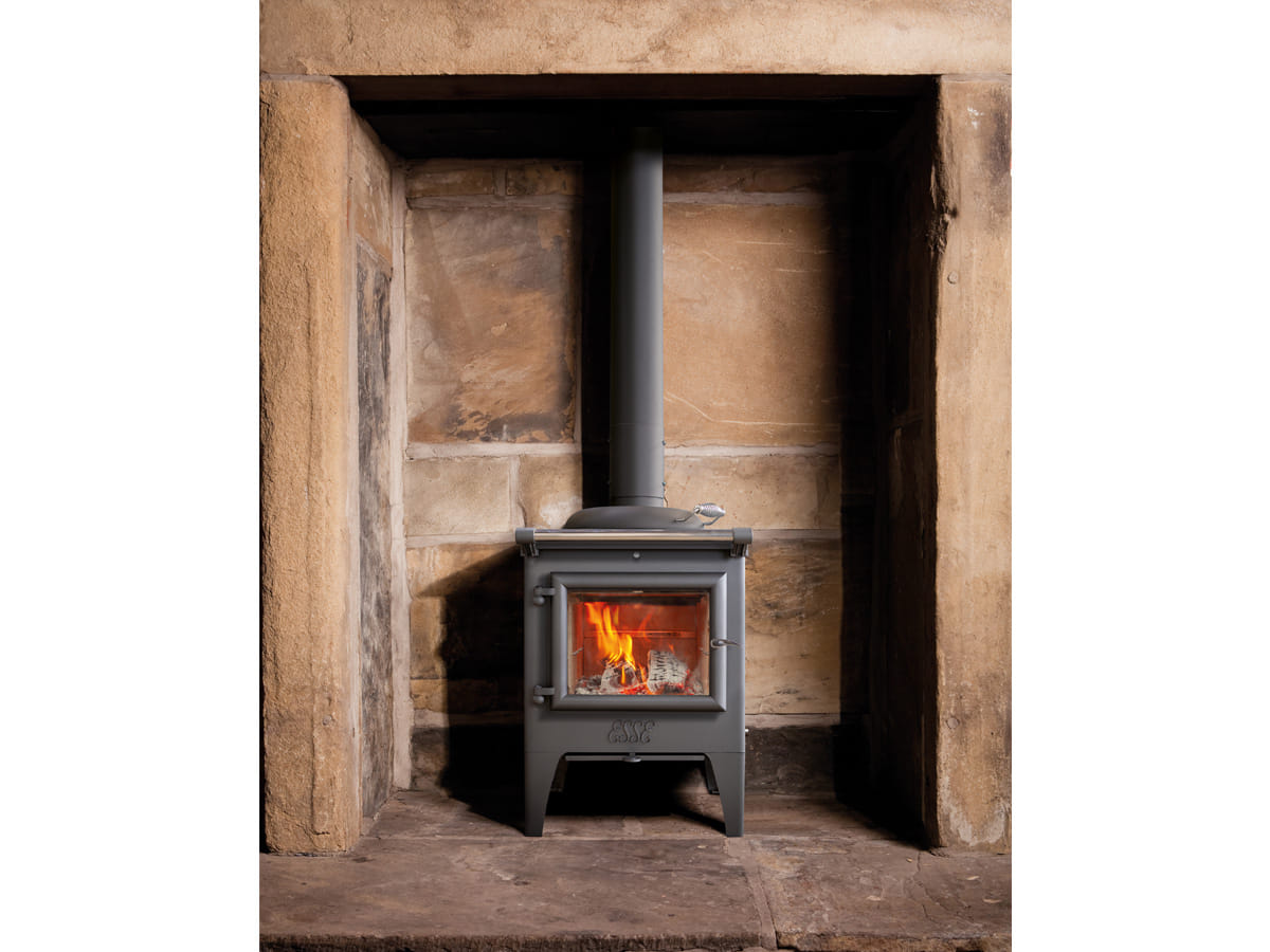 ESSE Warmheart wood-fired cook stove installed in a furnished room