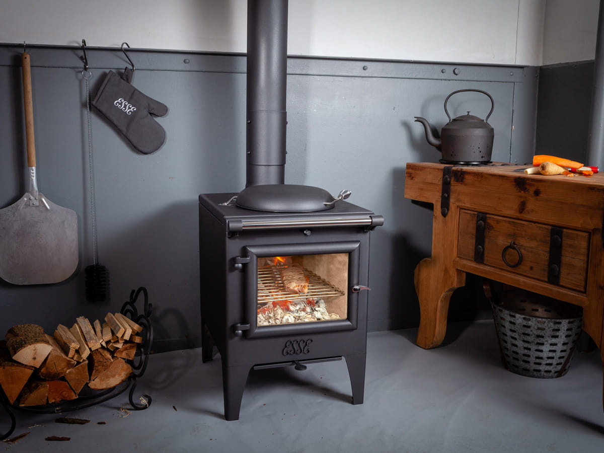 ESSE Warmheart wood-fired cook stove installed in a furnished room