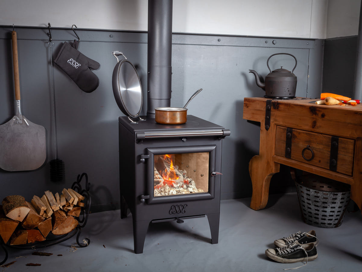 ESSE Warmheart wood-fired cook stove installed in a furnished room