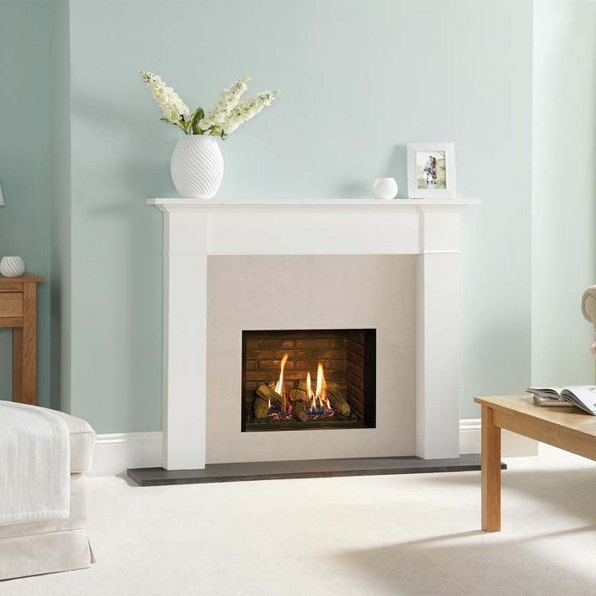 Gazco Riva2 500 Edge gas fire with brick-effect lining in a white fireplace