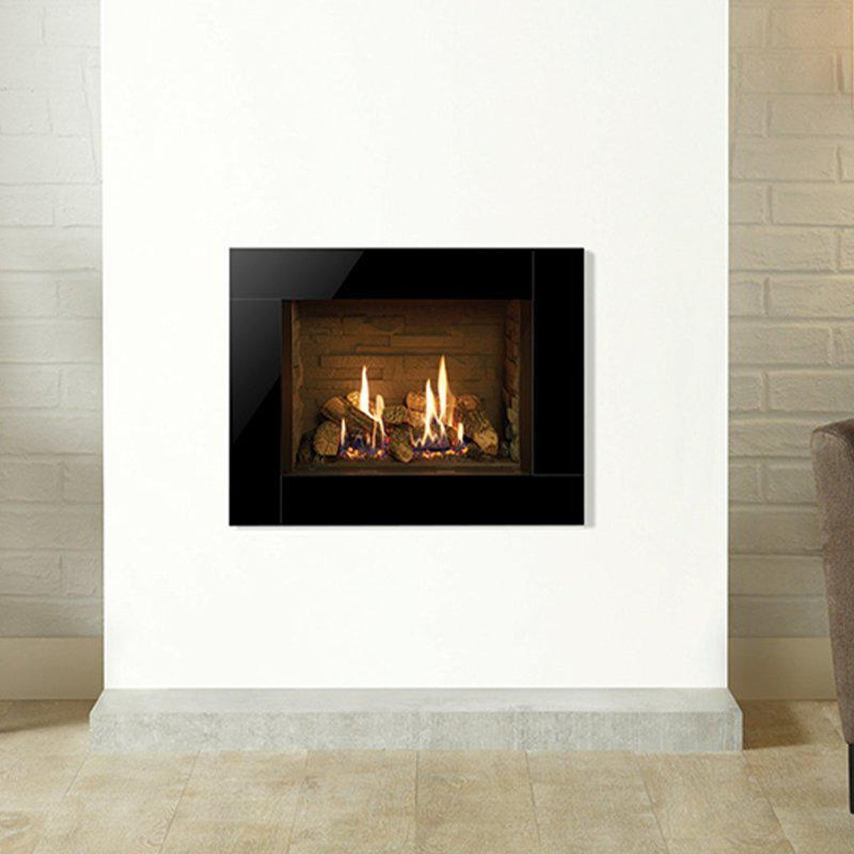 Gazco Riva2 500 Icon XS gas fire with a black glass frame and Ledgestone lining