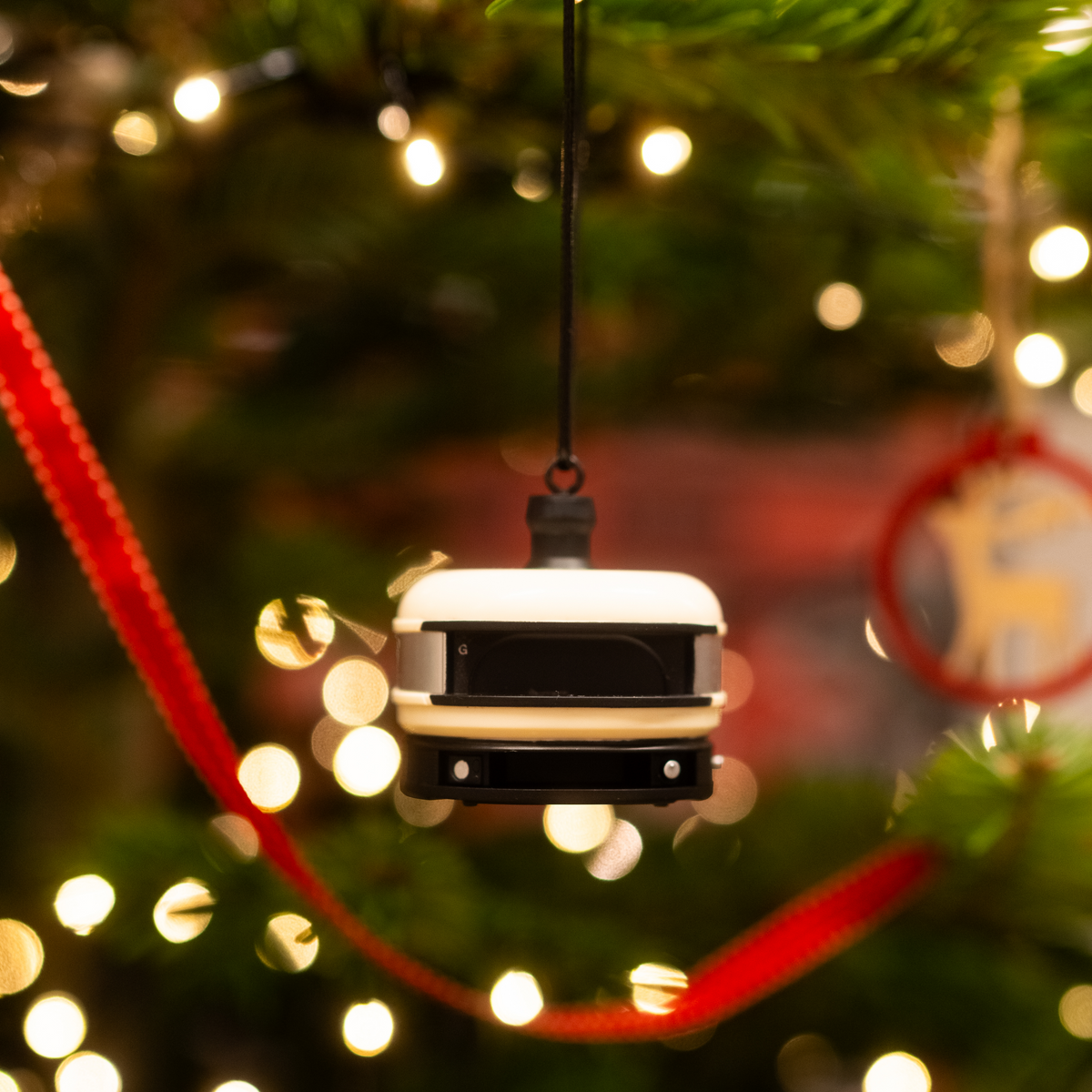 Gozney Dome Ornament hanging on a Christmas tree